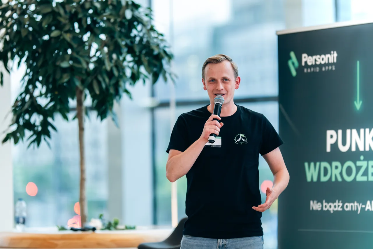Personit speaker on stage at Pionierzy AI in the PKO Rotunda, Warsaw